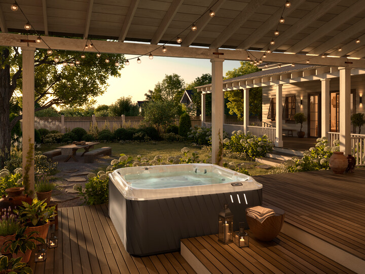 J-285 Hot Tub - Luxury Hot Tubs - Grey Hot Tub On A Patio With String Lights Above