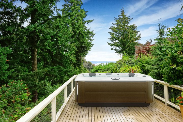 Luxury Hot Tubs - Hot Tub On A Deck Surrounded By Trees